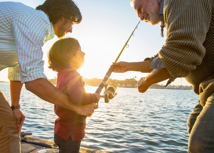 father and sons fishing